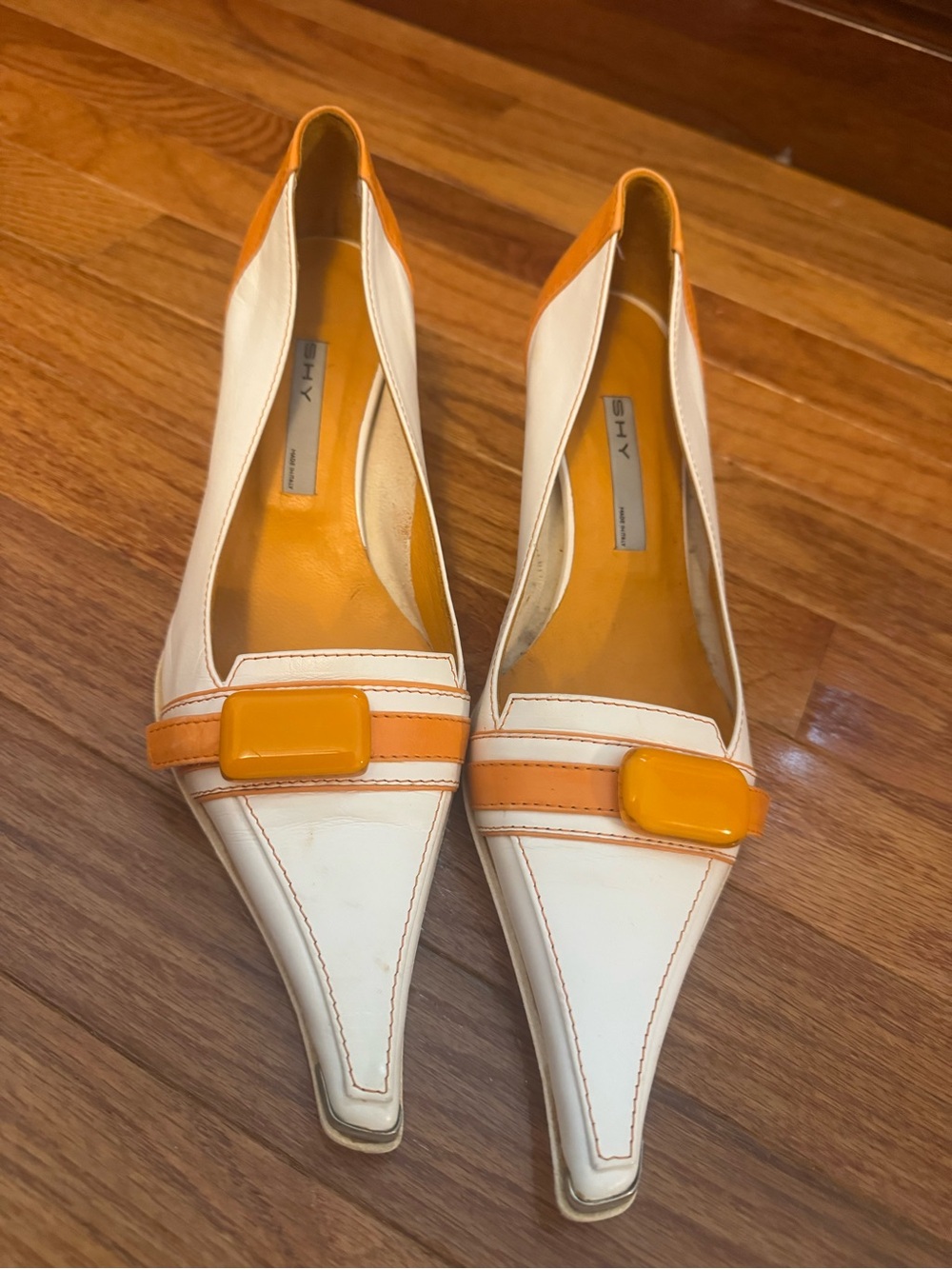 White and Orange Pointed-Toe Leather Flats